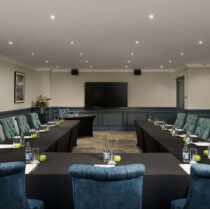 Elegant conference room with long tables set up for a meeting at Springfield Hotel.