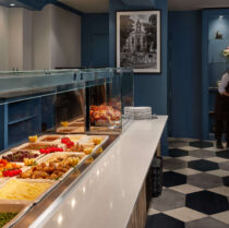 Guests enjoy a warm, inviting buffet at Springfield Hotel's elegant dining area.
