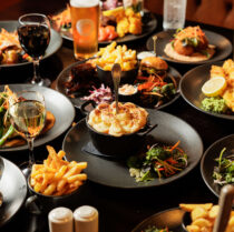A lively family enjoys a hearty meal at Springfield Hotel's elegant restaurant.