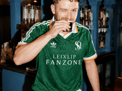 Man winking while enjoying a drink at a Springfield Hotel bar.