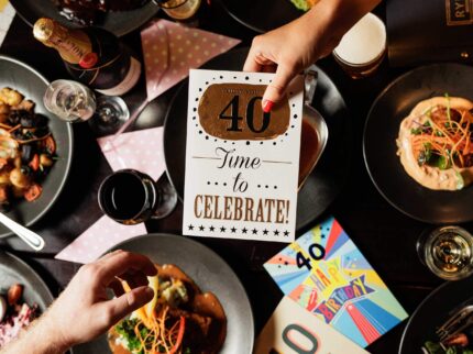 Family celebrating 40th birthday with food and cards at Springfield Hotel.