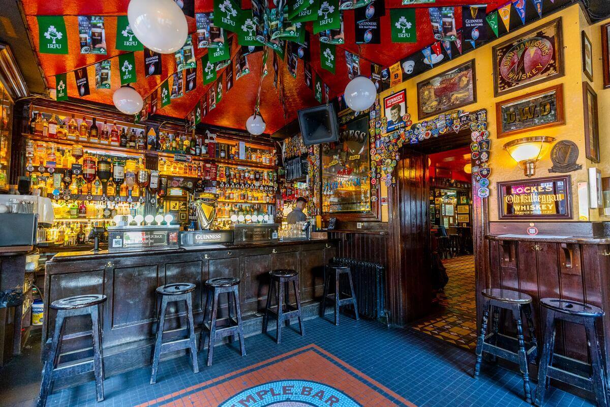 Cosy hotel pub with a lively family enjoying drinks and conversation.