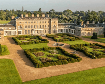 Grand historic hotel amidst lush gardens in Springfield, ideal for family retreats.
