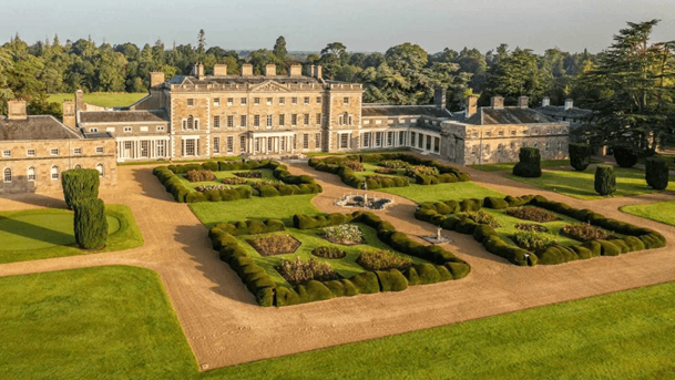 Grand historic hotel amidst lush gardens in Springfield, ideal for family retreats.